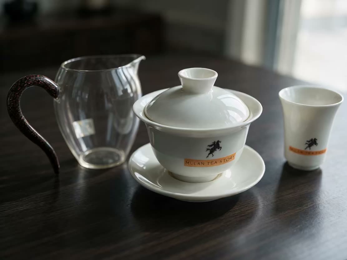 A white porcelain gaiwan being thrown on the wheel